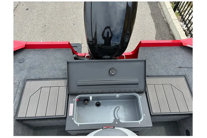 Slide: The Image of 2027 Tracker Pro Guide V-175 Combo boat interior with open storage compartment. - 13