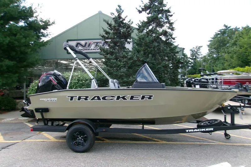 The Image of 2027 Tracker Pro Guide V-175 Combo boat on trailer, parked outdoors. - 0