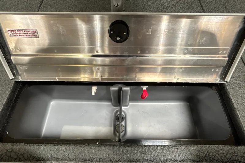 Slide: The Image of Livewell compartment in 2027 Tracker Pro Team 175 boat with pump-out feature. - 19
