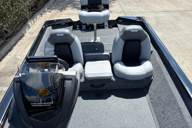 Slide: The Image of 2027 Tracker Pro Team 175 boat interior with gray seating and steering console. - 13