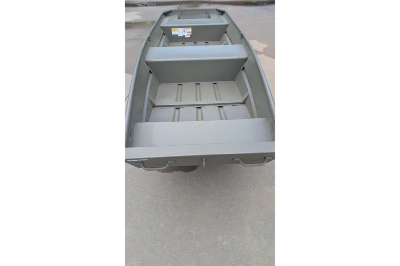 The Image of 2027 Tracker Grizzly 14 Jon boat, interior view, showcasing seating and storage layout. - 0