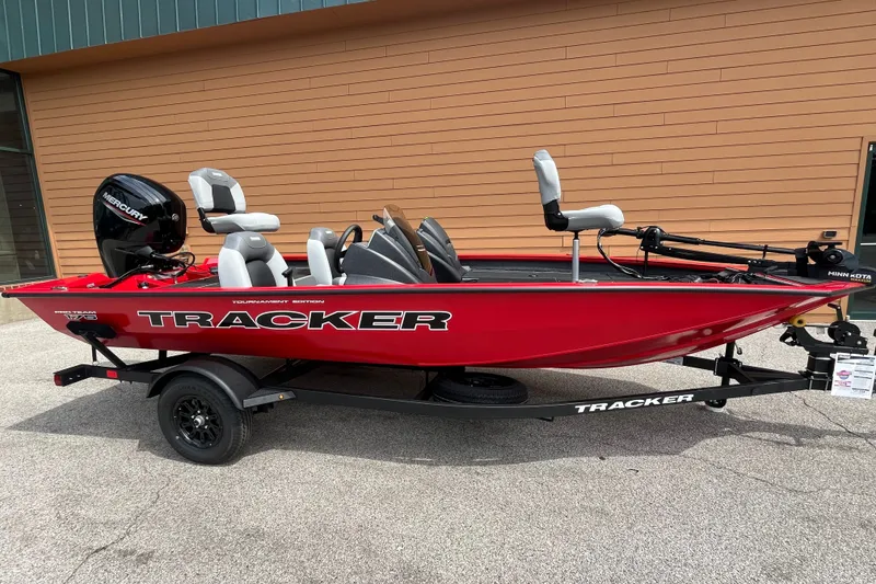 The Image of 2027 Tracker Pro Team 175 boat in vibrant red on a trailer. - 0