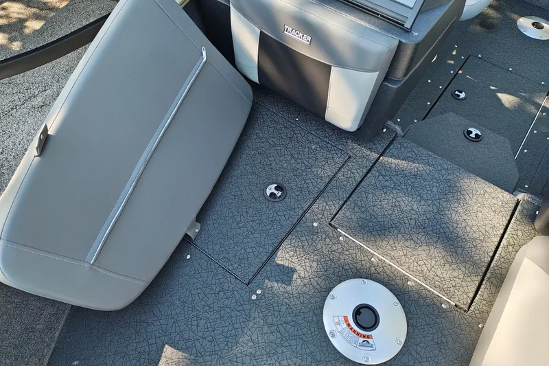 Slide: The Image of 2027 Tracker Pro Guide V-175 Combo boat interior with gray seating and textured flooring. - 19