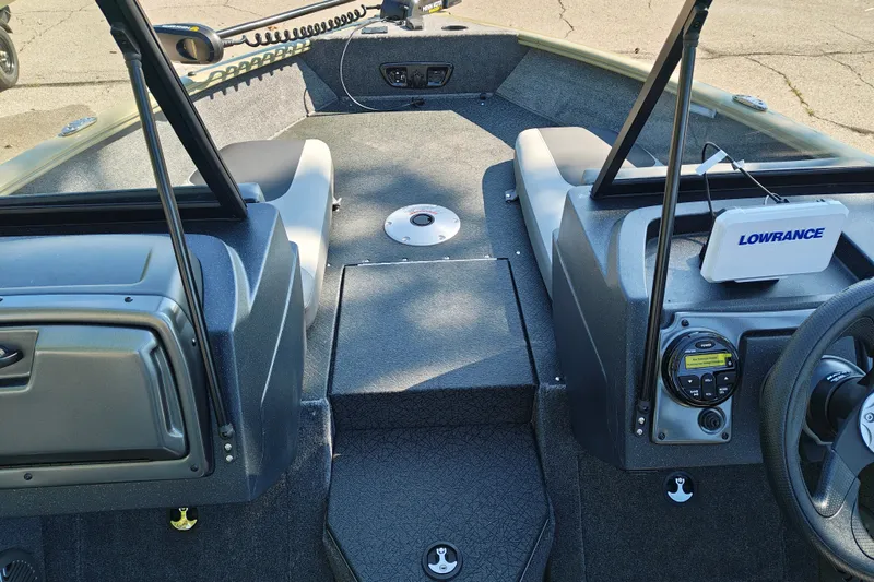 Slide: The Image of 2027 Tracker Pro Guide V-175 Combo boat interior with Lowrance electronics and seating. - 14