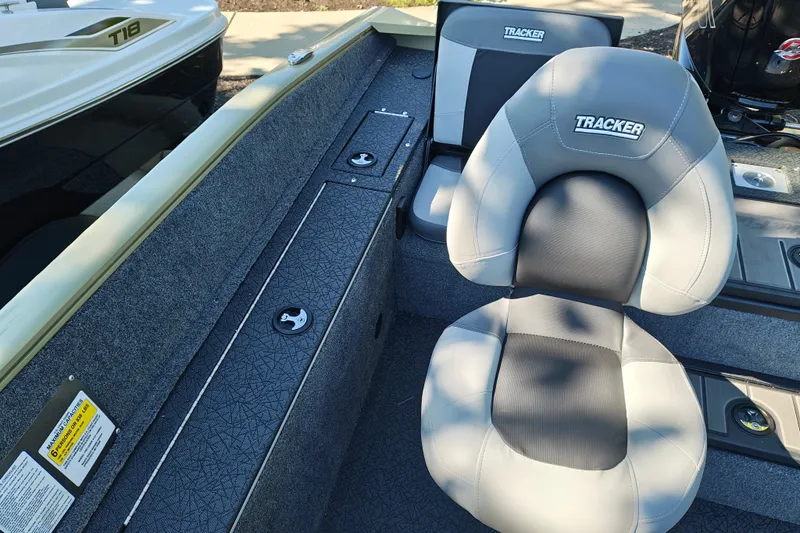 Slide: The Image of 2027 Tracker Pro Guide V-175 Combo boat interior with cushioned seating and storage compartments. - 23