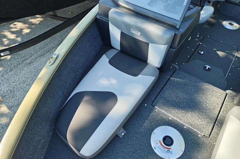 Slide: The Image of 2027 Tracker Pro Guide V-175 Combo boat interior with cushioned seating and storage compartments. - 18