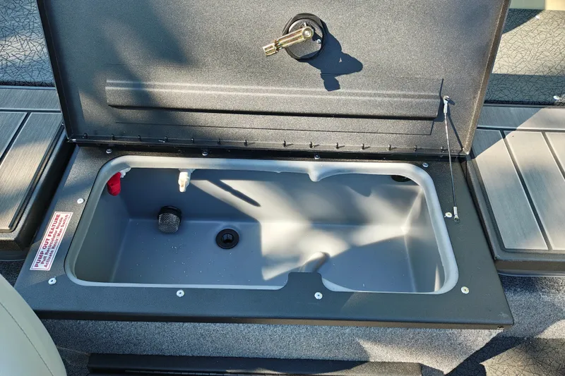 Slide: The Image of Open storage compartment on 2027 Tracker Pro Guide V-175 Combo boat. - 26