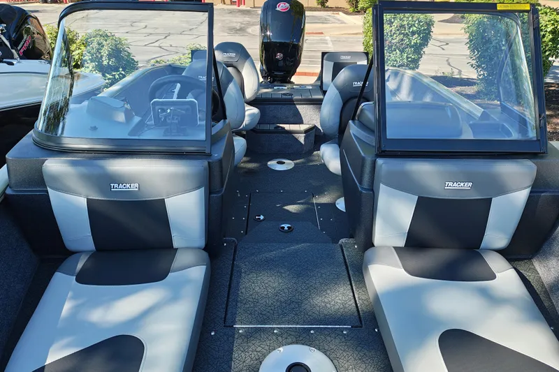 Slide: The Image of 2027 Tracker Pro Guide V-175 Combo boat interior with seating and dashboard view. - 17