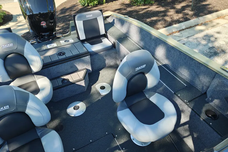 Slide: The Image of 2027 Tracker Pro Guide V-175 Combo boat interior with cushioned seats and storage compartments. - 21
