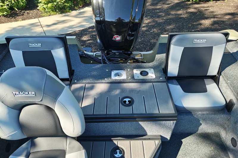 Slide: The Image of 2027 Tracker Pro Guide V-175 Combo boat interior with seating and motor. - 24