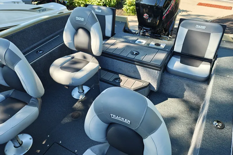 Slide: The Image of 2027 Tracker Pro Guide V-175 Combo boat interior with cushioned seating and storage compartments. - 22