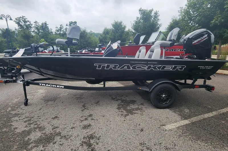 The Image of 2027 Tracker Pro Team 175 boat on trailer, parked outdoors. - 0