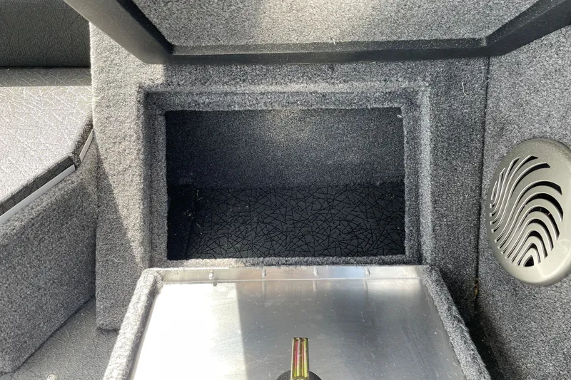 Slide: The Image of 2027 Tracker Pro Guide V-175 Combo boat interior storage compartment with speaker detail. - 28