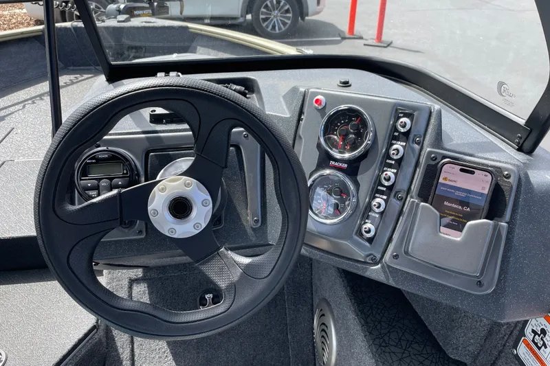 Slide: The Image of Steering console of 2027 Tracker Pro Guide V-175 Combo boat with gauges and smartphone holder. - 25