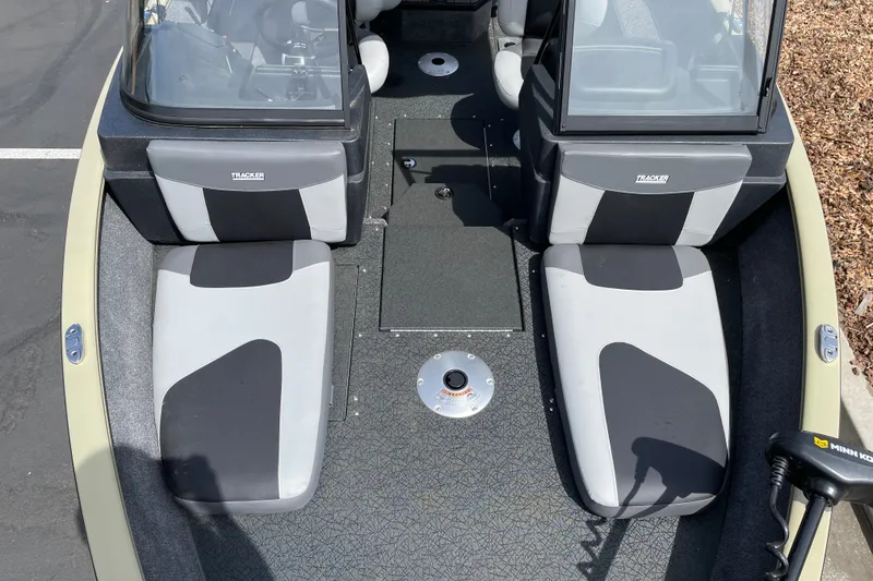 Slide: The Image of 2027 Tracker Pro Guide V-175 Combo boat interior with dual seats and windshield. - 29