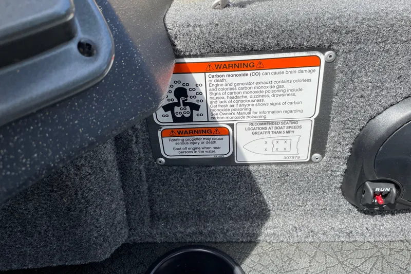 Slide: The Image of Warning labels on 2027 Tracker Pro Guide V-175 Combo boat interior. - 35