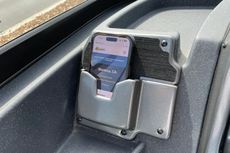 Slide: The Image of Phone holder in 2027 Tracker Pro Guide V-175 Combo boat, displaying a website. - 18