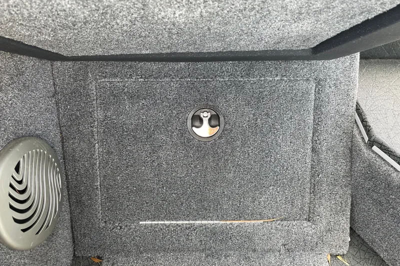 Slide: The Image of Carpeted storage compartment in 2027 Tracker Pro Guide V-175 Combo boat interior. - 20