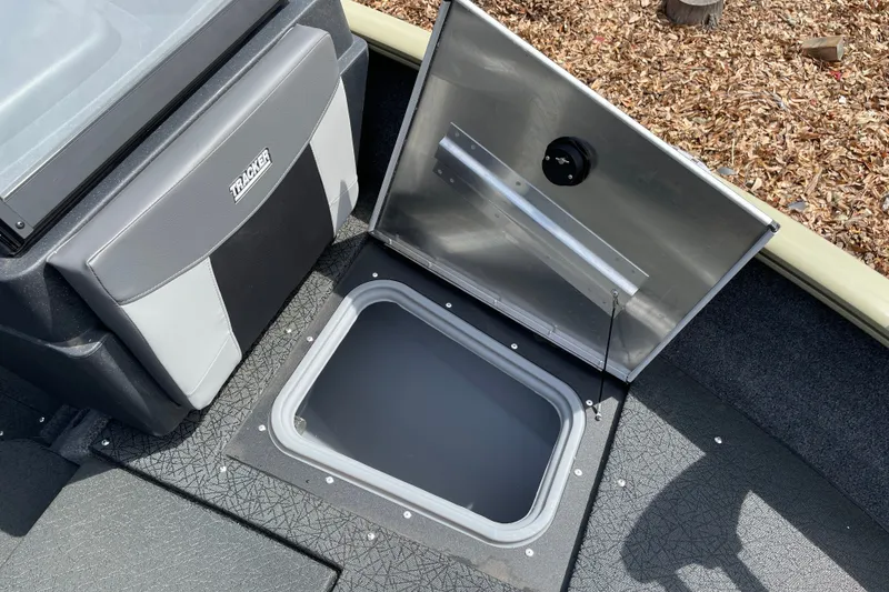 Slide: The Image of Open storage compartment on 2027 Tracker Pro Guide V-175 Combo boat. - 31