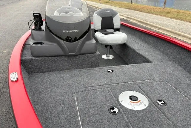 Slide: The Image of 2027 Tracker Super Guide V-16 SC boat with gray interior and red trim. - 18
