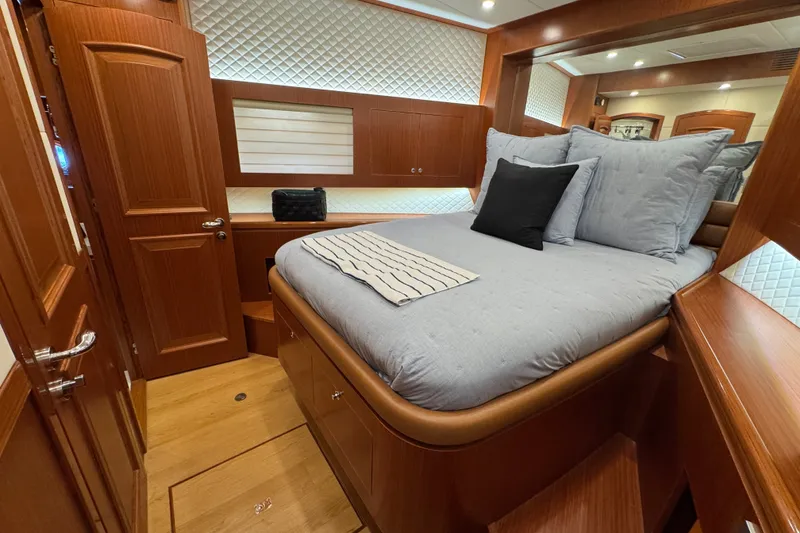 Slide: The Image of Luxurious cabin interior of 2023 Apollonian Yachts 52 Pilothouse, featuring elegant wood finishes. - 28