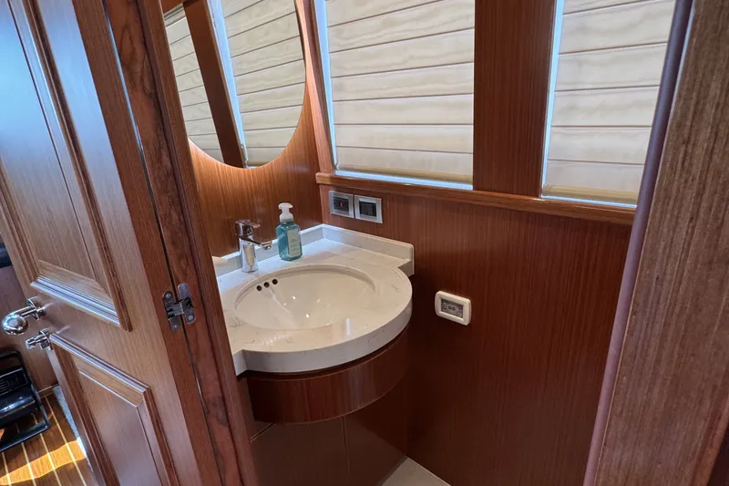 Slide: The Image of Luxurious bathroom in 2023 Apollonian Yachts 52 Pilothouse with elegant wood finish. - 10