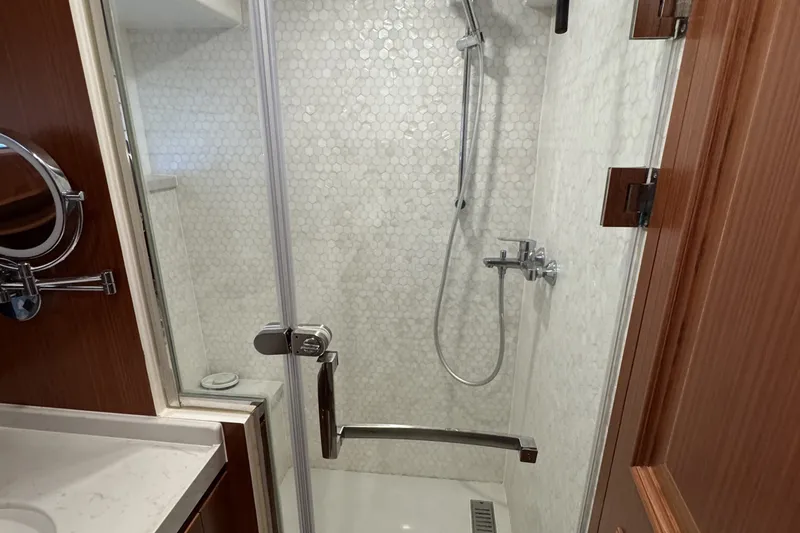 Slide: The Image of Luxurious shower in 2023 Apollonian Yachts 52 Pilothouse, featuring elegant tile and modern fixtures. - 18