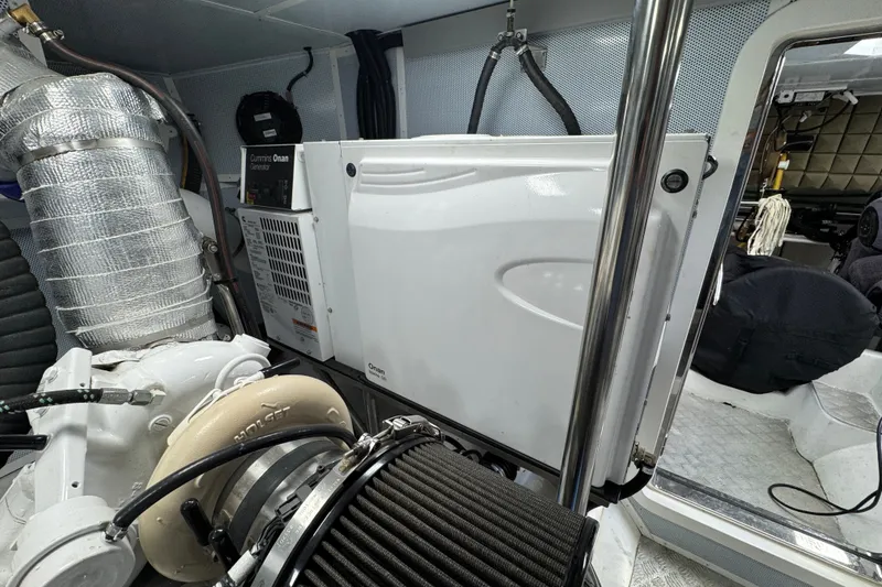 Slide: The Image of Engine room of 2023 Apollonian Yachts 52 Pilothouse with Cummins Onan generator. - 44