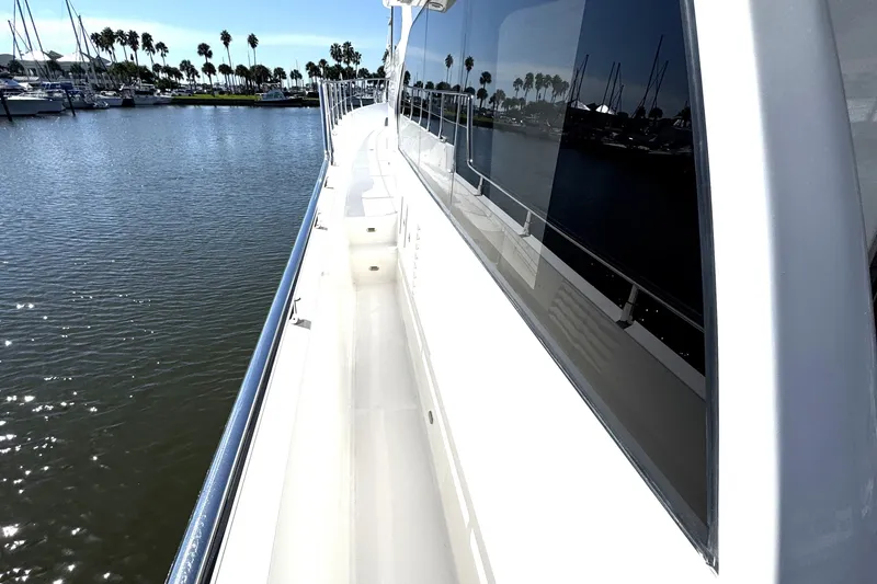 Slide: The Image of 2023 Apollonian Yachts 52 Pilothouse deck view with marina backdrop. - 5
