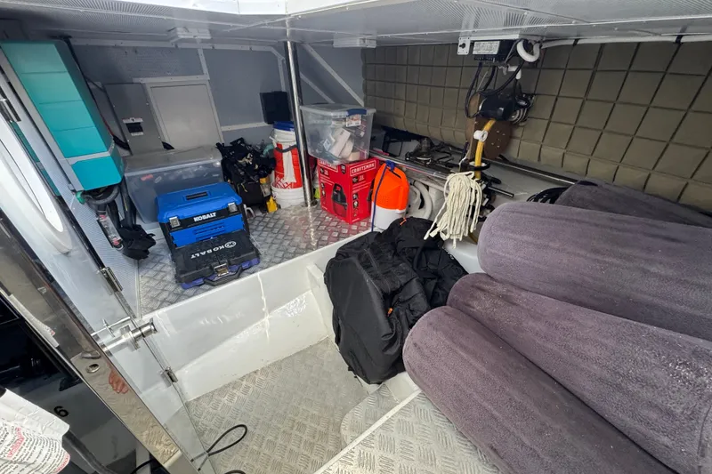 Slide: The Image of Storage area in 2023 Apollonian Yachts 52 Pilothouse with tools and equipment. - 46