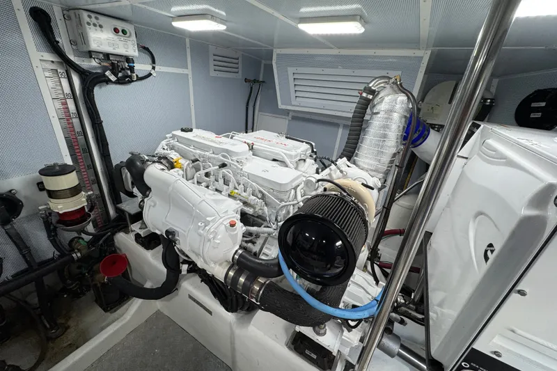 Slide: The Image of Engine room of 2023 Apollonian Yachts 52 Pilothouse, showcasing modern marine engine. - 41
