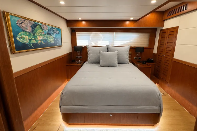Slide: The Image of Luxurious bedroom interior of 2023 Apollonian Yachts 52 Pilothouse with elegant wood paneling. - 13