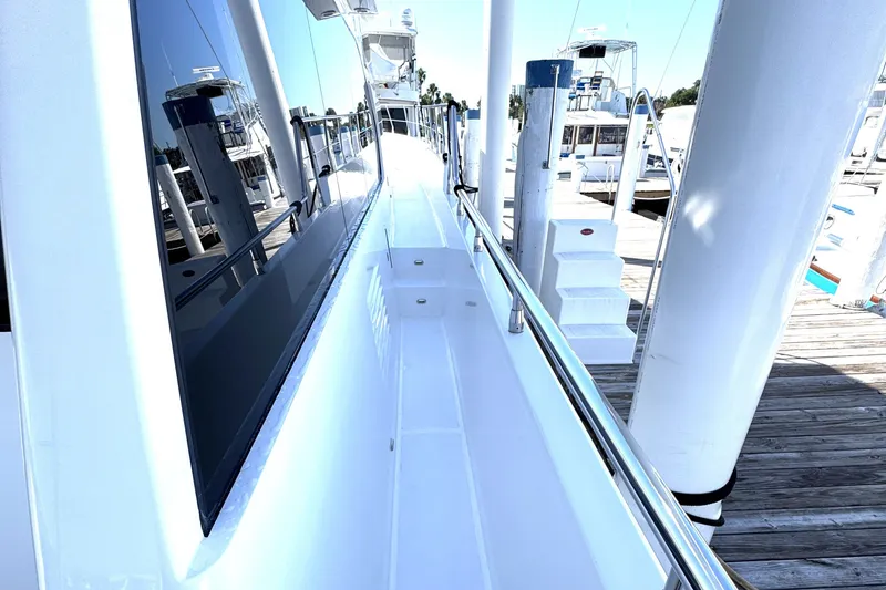 Slide: The Image of Side view of 2023 Apollonian Yachts 52 Pilothouse docked at marina. - 6