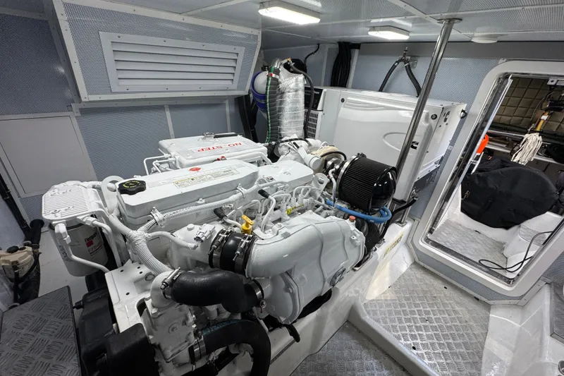 Slide: The Image of Engine room of 2023 Apollonian Yachts 52 Pilothouse, showcasing modern marine machinery. - 43