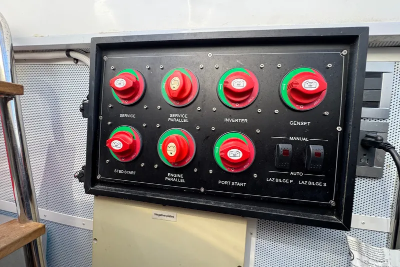 Slide: The Image of Control panel on 2023 Apollonian Yachts 52 Pilothouse, featuring switches and indicators. - 47