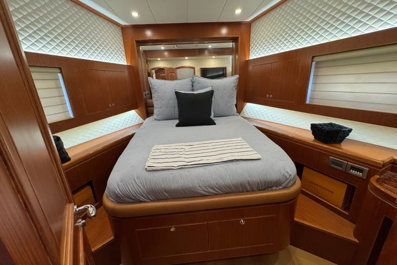 Slide: The Image of Luxurious bedroom interior of 2023 Apollonian Yachts 52 Pilothouse, featuring elegant wood finishes. - 27