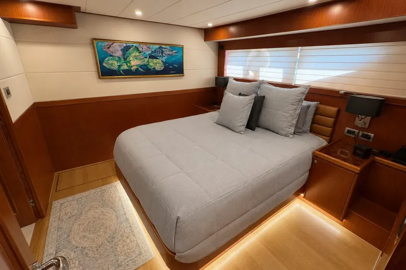 Slide: The Image of Luxurious bedroom interior of 2023 Apollonian Yachts 52 Pilothouse, featuring elegant wood finishes. - 15