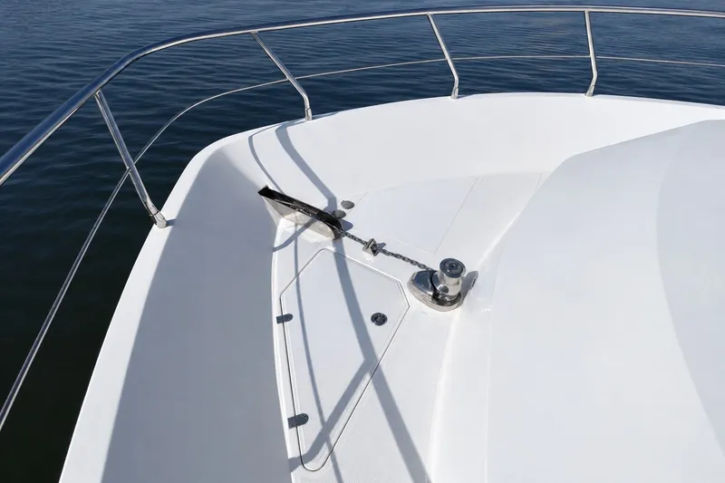 Slide: The Image of Bow of 2023 Apollonian Yachts 52 Pilothouse with anchor and railing. - 4