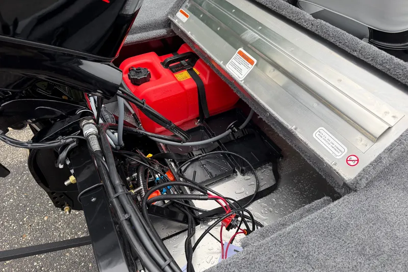 Slide: The Image of Interior view of a 2027 Tracker Super Guide V-16 SC boat, showing fuel tank and wiring. - 16
