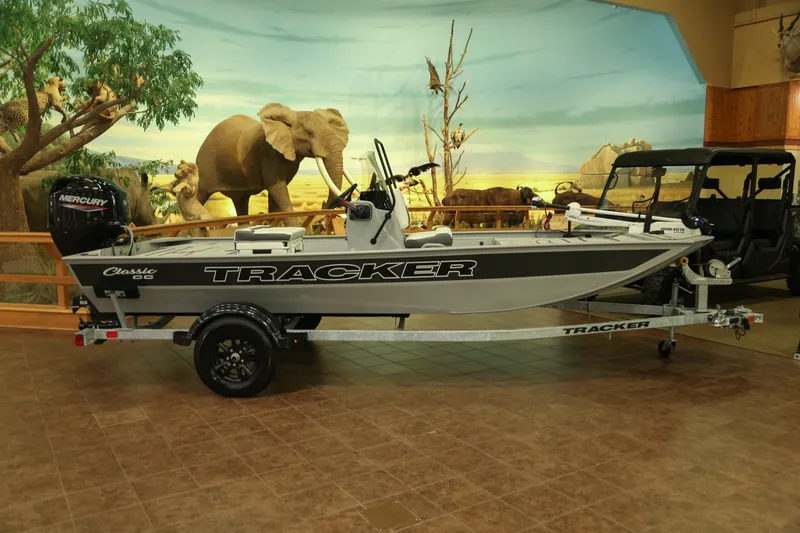 The Image of 2027 Tracker Bass Tracker Classic CC boat displayed indoors with wildlife backdrop. - 0