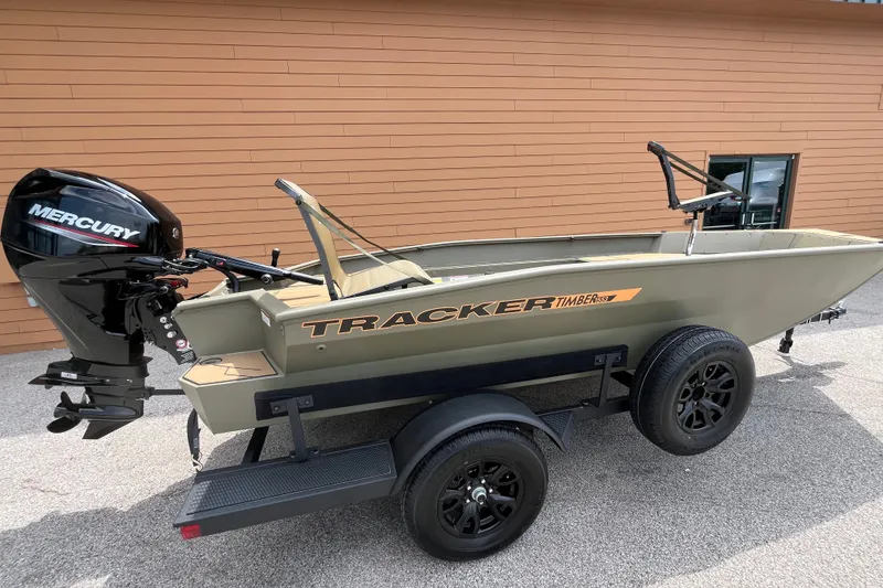The Image of 2027 Tracker Grizzly 1553 Timber boat with Mercury engine on trailer. - 0