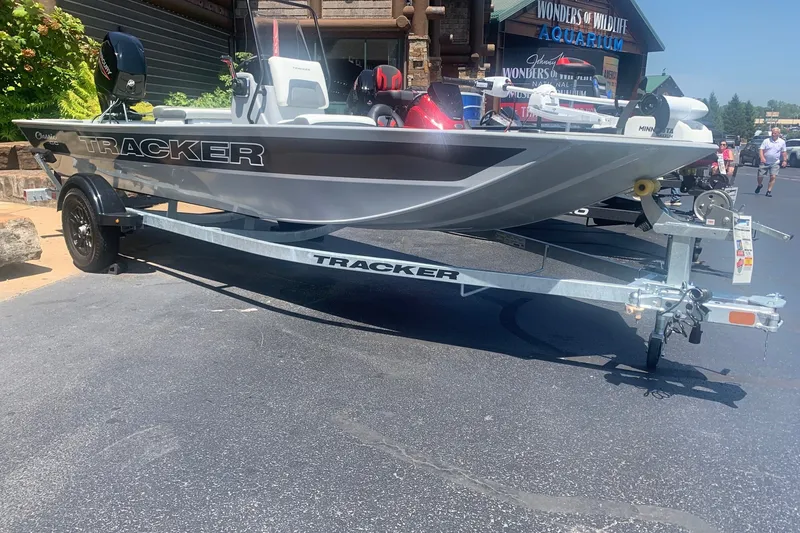 The Image of 2027 Tracker Bass Tracker Classic CC boat on trailer, parked outdoors. - 0