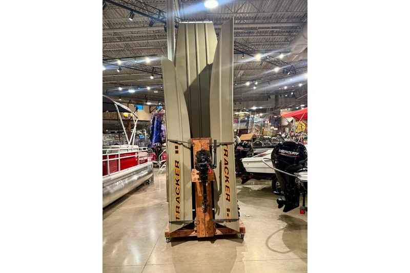 The Image of 2027 Tracker Grizzly 14 Jon boats displayed vertically in a showroom. - 0
