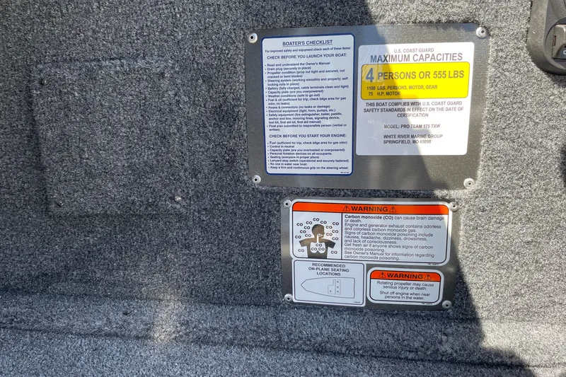 Slide: The Image of 2027 Tracker Pro Team 175 safety and capacity labels, detailing maximum load and warnings. - 22