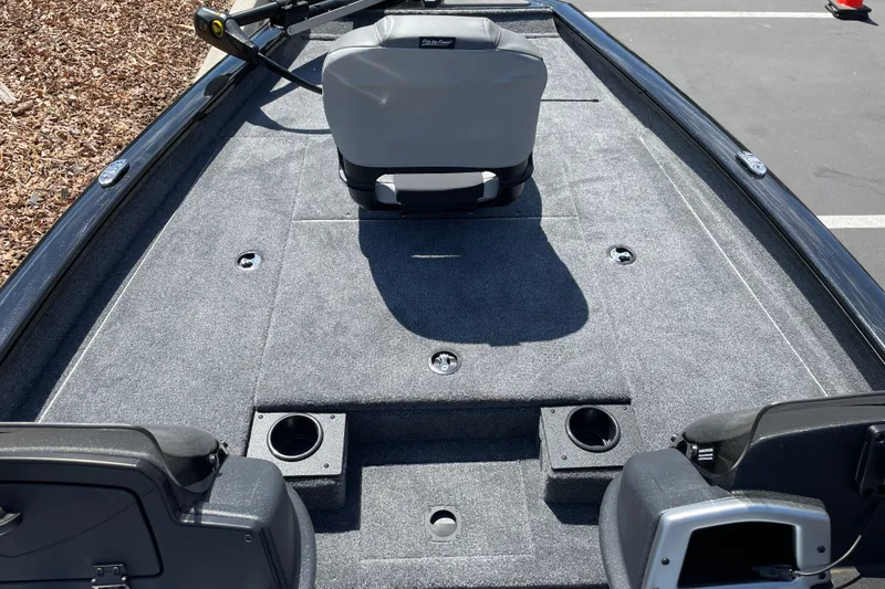 Slide: The Image of 2027 Tracker Pro Team 175 boat interior with gray carpet and seating. - 15
