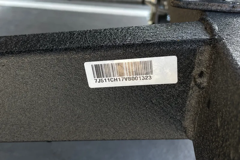 Slide: The Image of Barcode sticker on 2027 Tracker Pro Team 175 boat frame, displaying serial number. - 60