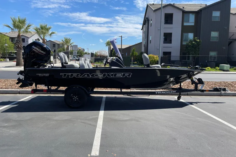 The Image of 2027 Tracker Pro Team 175 boat parked in a residential area. - 0