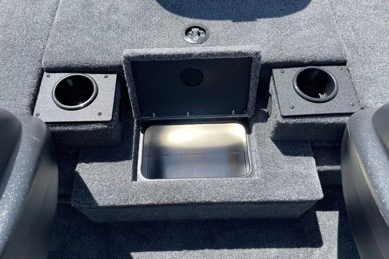 Slide: The Image of 2027 Tracker Pro Team 175 boat interior with storage compartment and cup holders. - 16