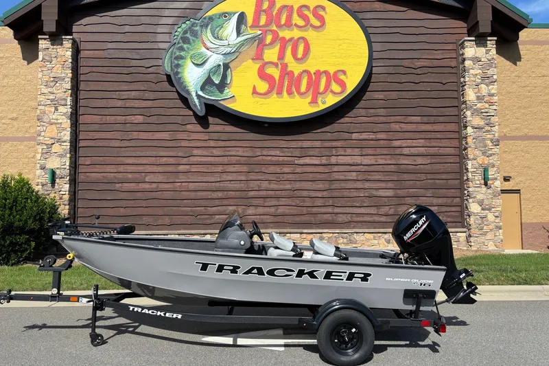 The Image of 2027 Tracker Super Guide V-16 SC boat displayed outside Bass Pro Shops. - 0