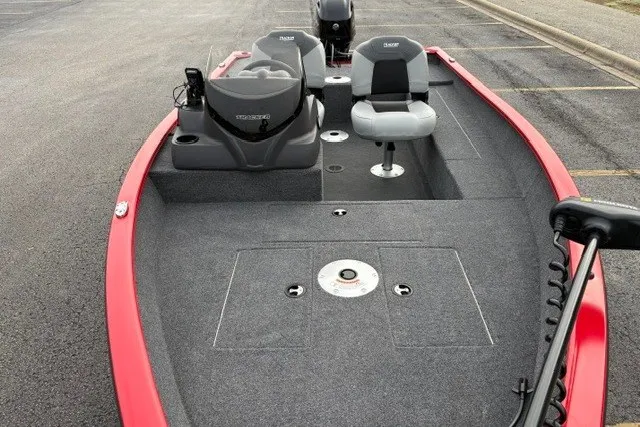 Slide: The Image of 2027 Tracker Super Guide V-16 SC fishing boat with red trim and dual seating. - 13